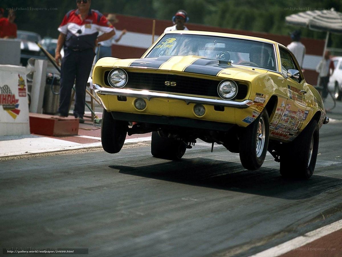 Yellow drag racing car on track