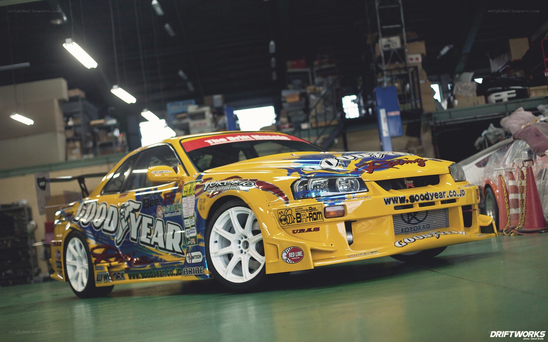 yellow drift car in garage