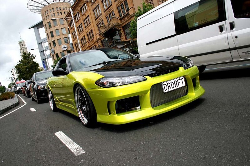 yellow drift car on city street