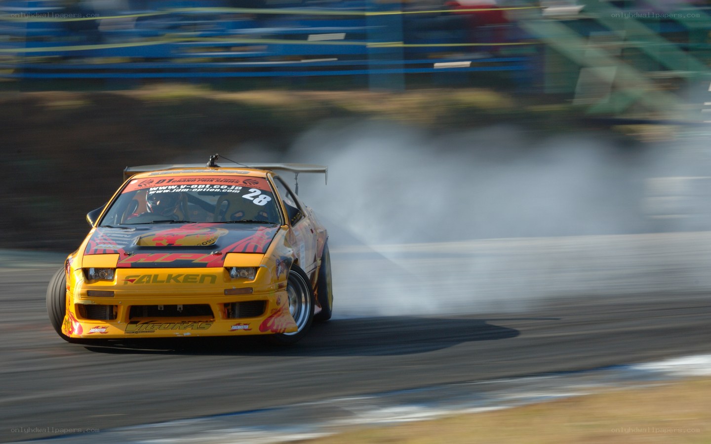 Yellow drift car on track