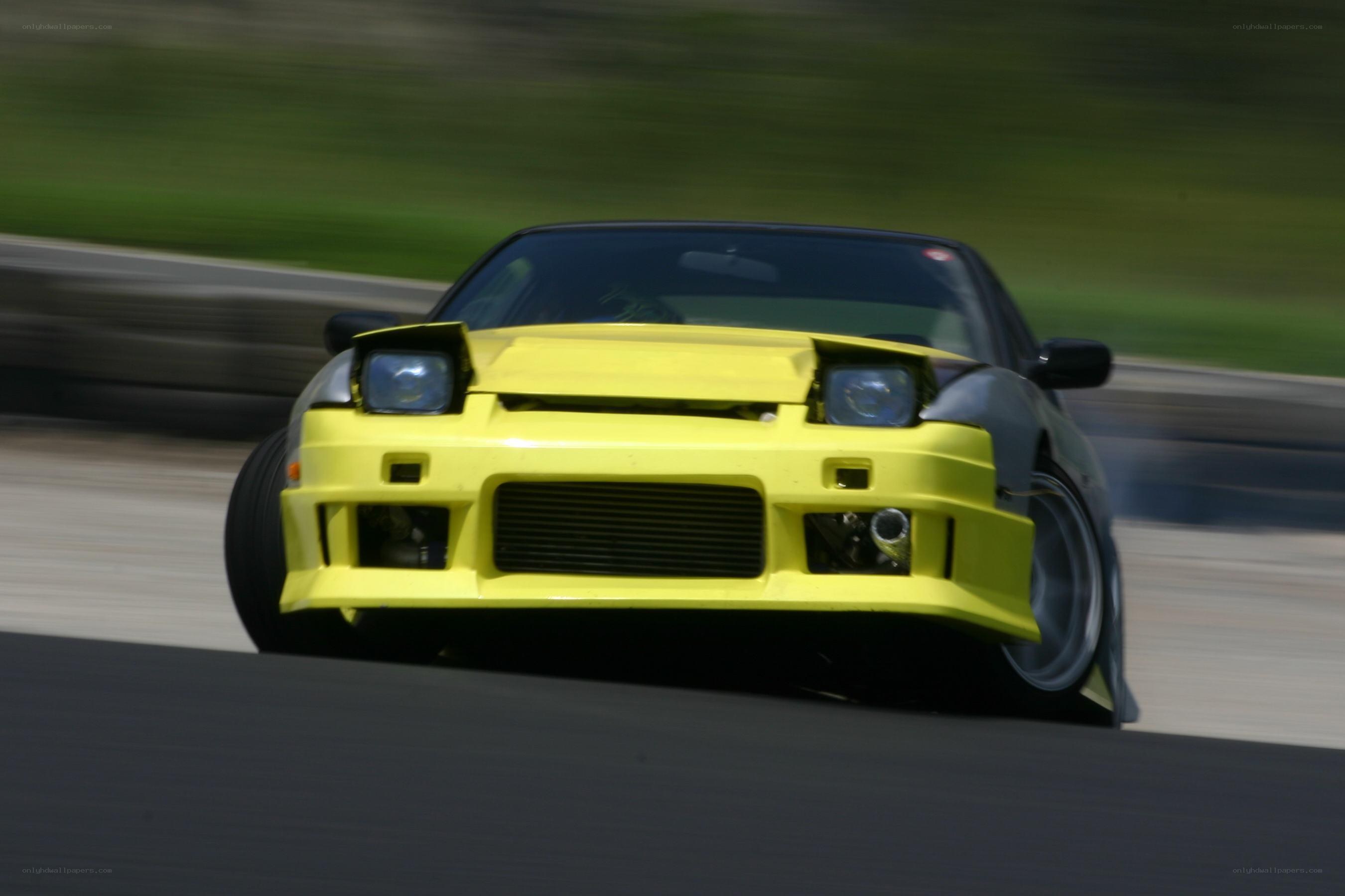 yellow drift car on track