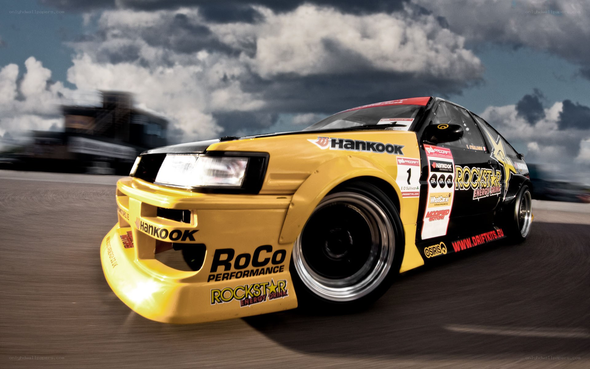 yellow drift car on track