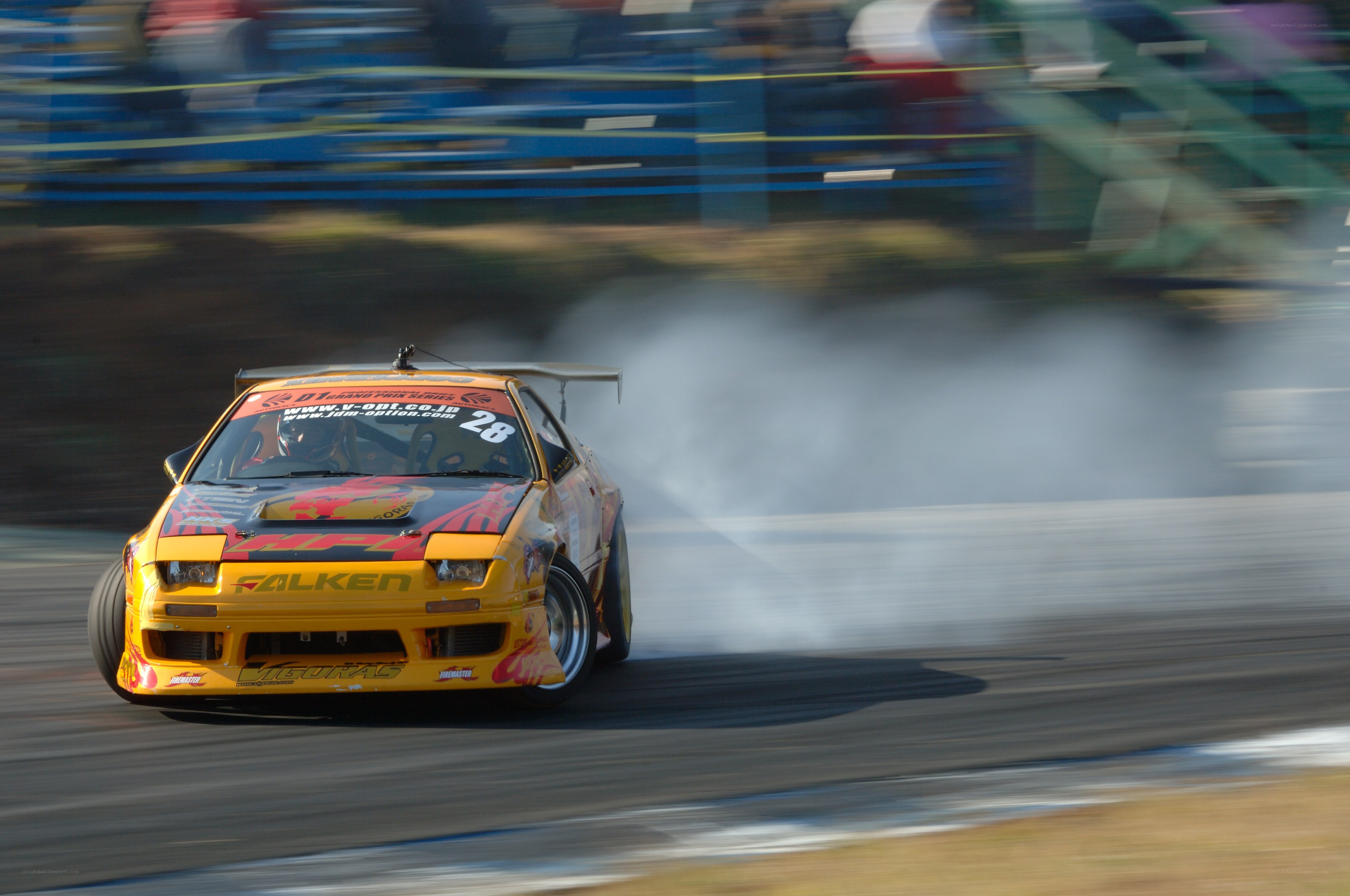 Yellow drift car on track