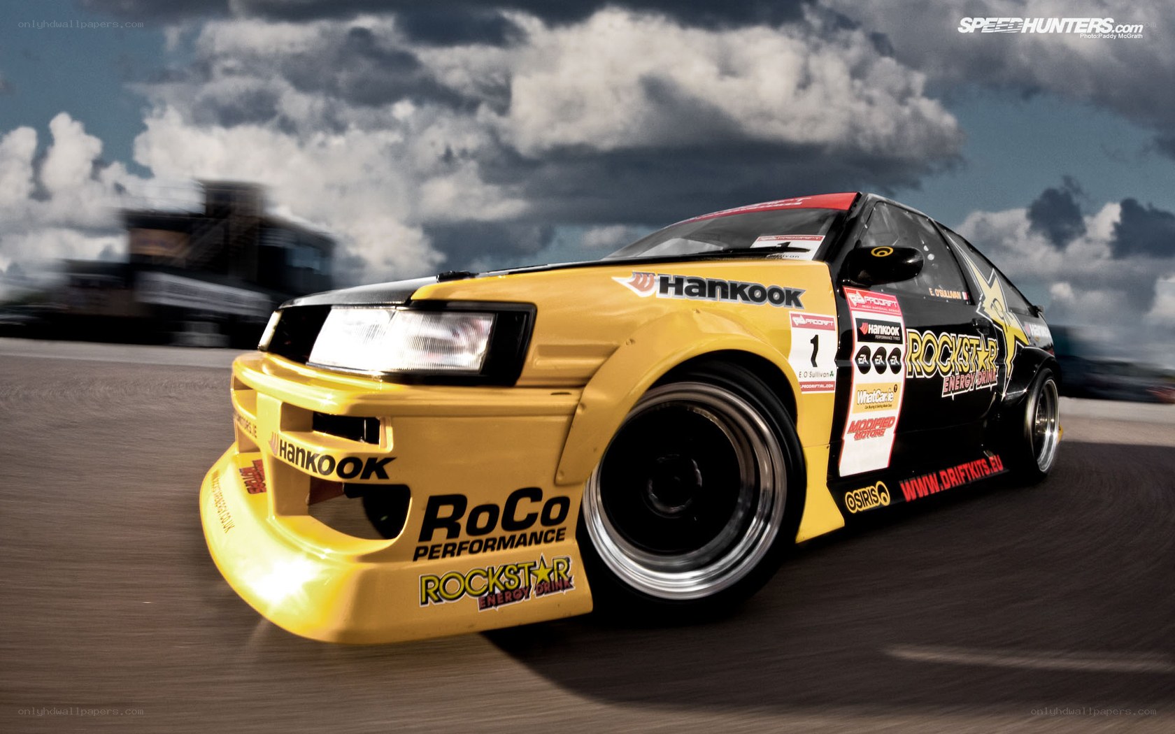 yellow drift car on track