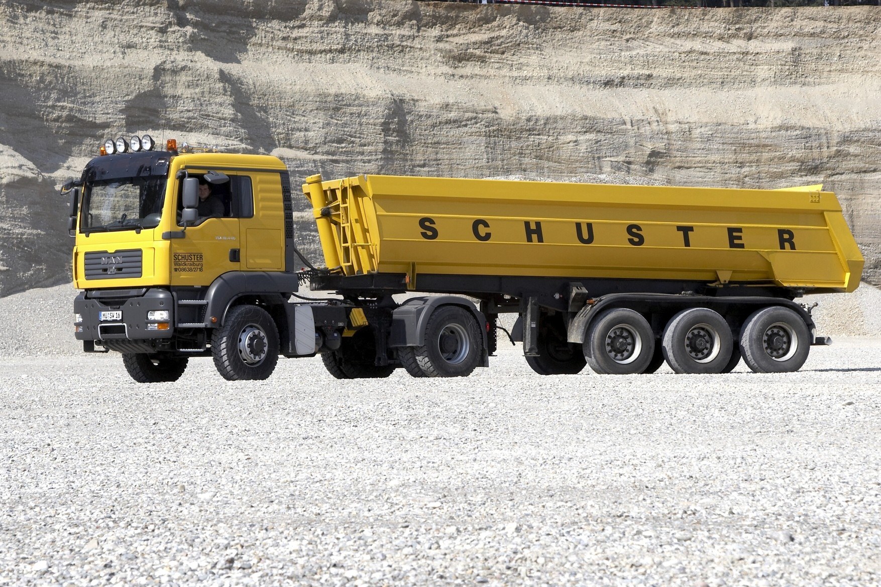 Yellow dump truck in quarry
