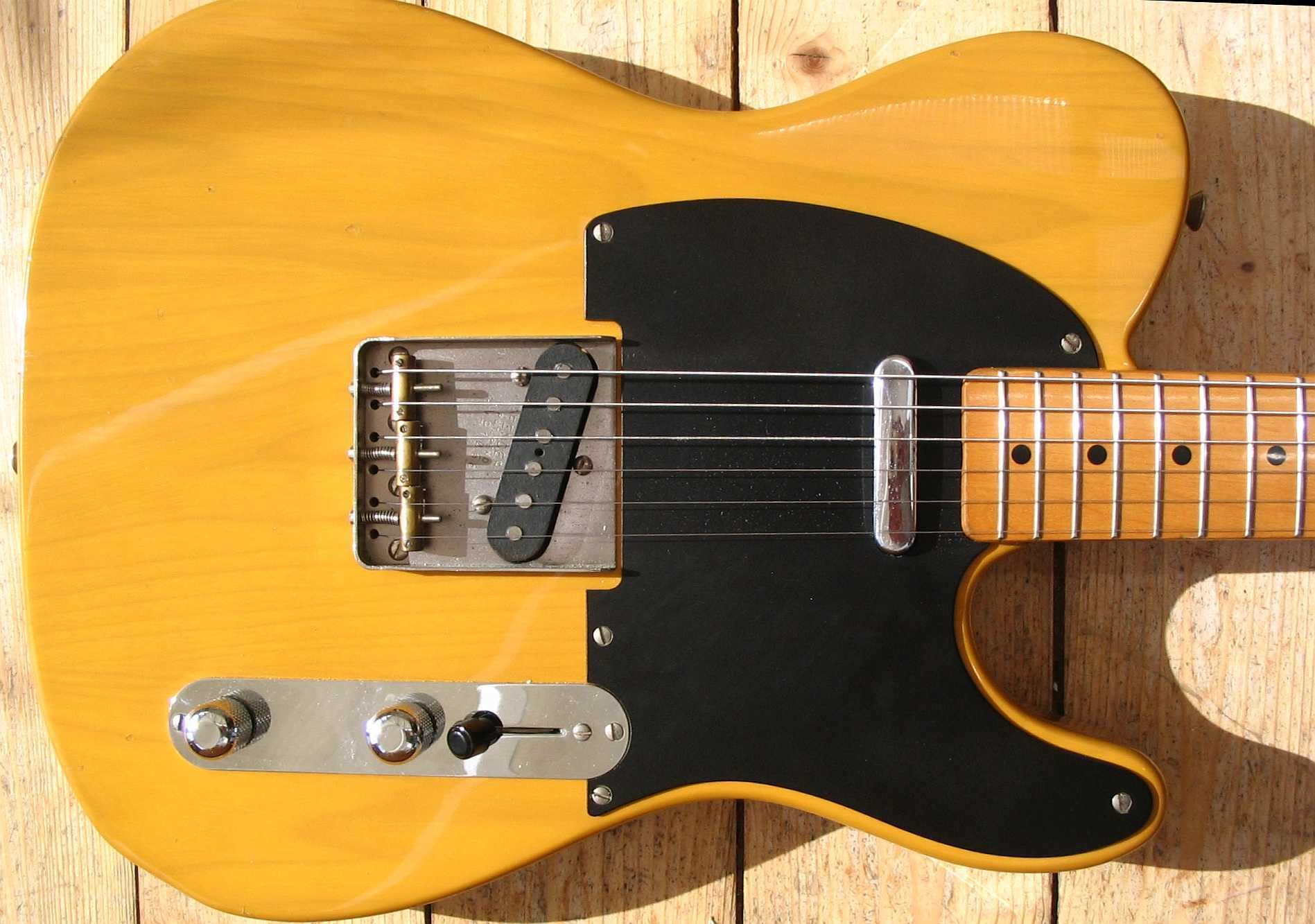 yellow electric guitar