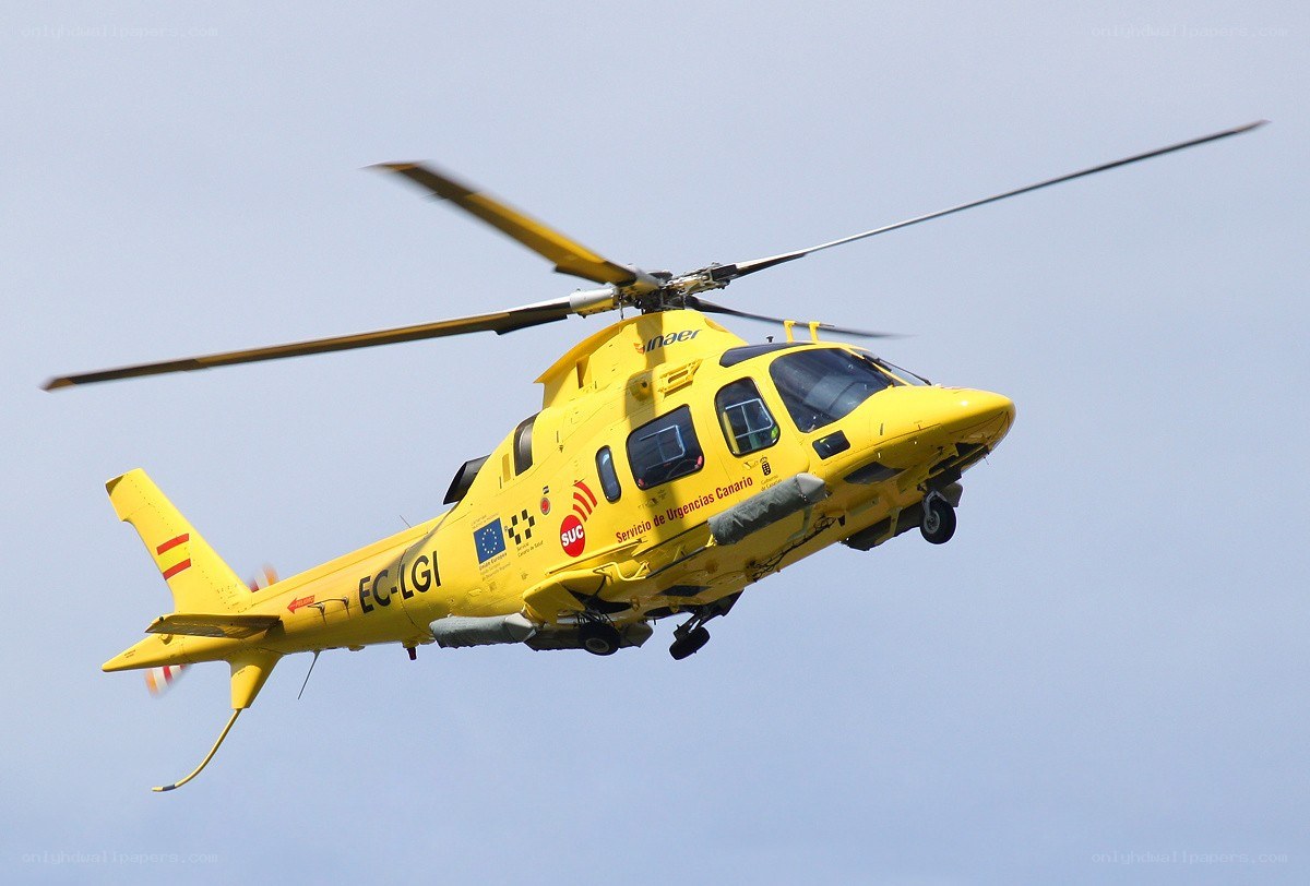 Yellow emergency helicopter in flight