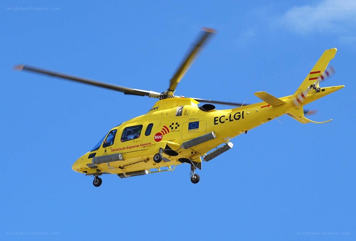 Yellow emergency helicopter in flight