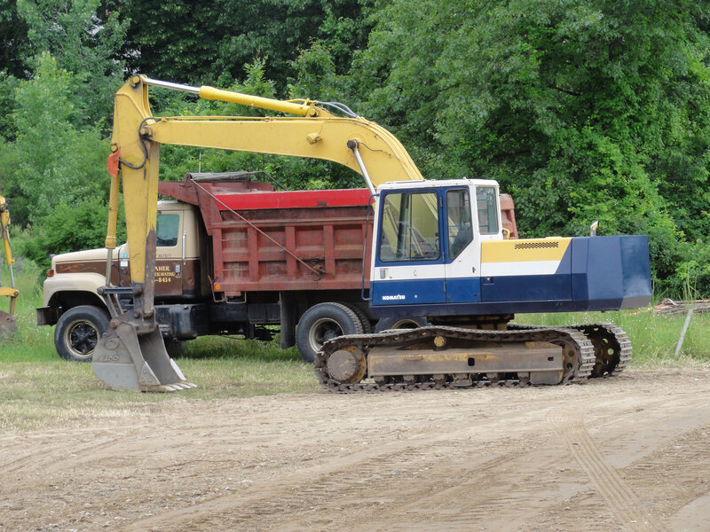 Yellow Excavator and Dump Truck