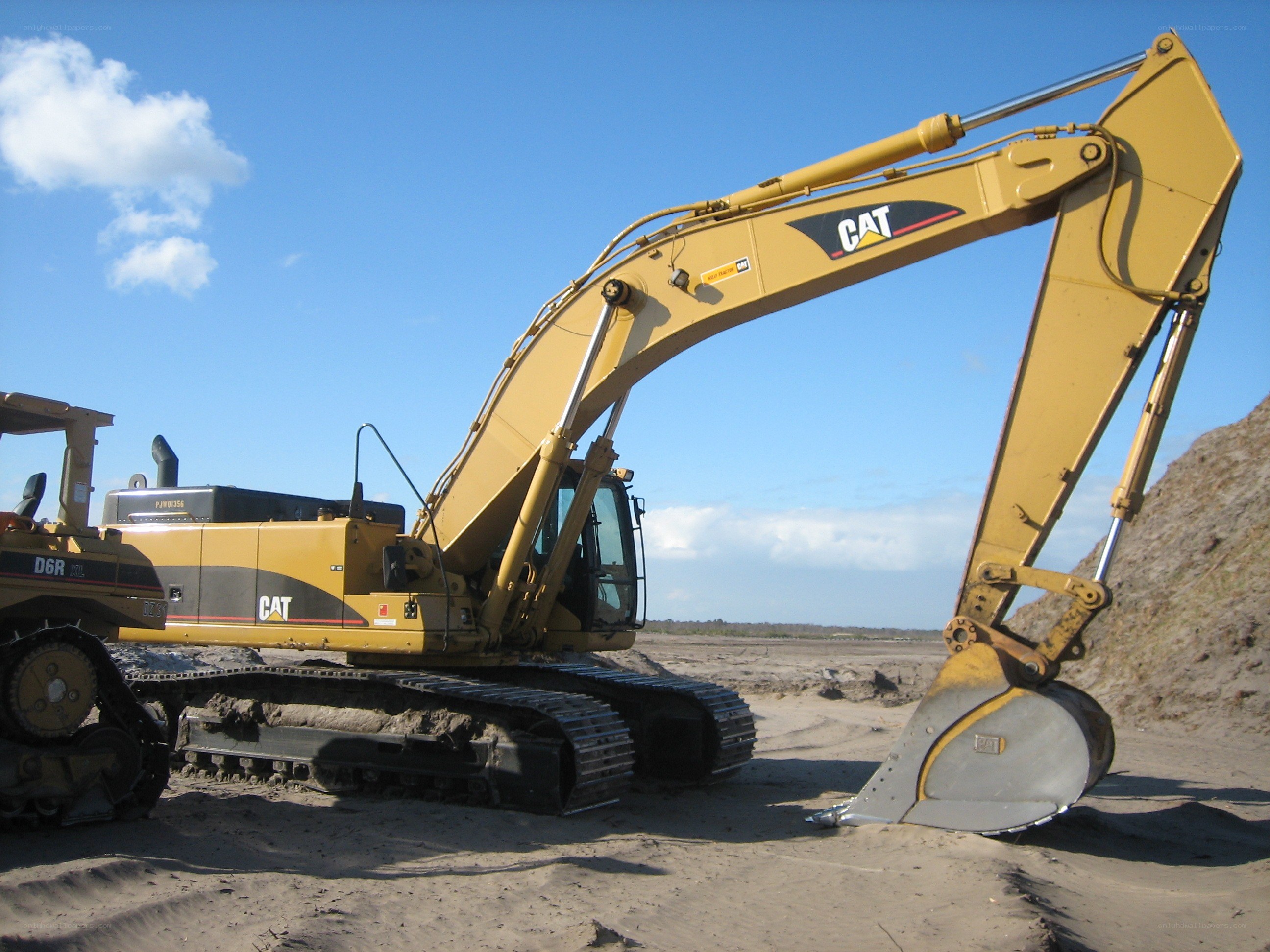 Yellow excavator at construction site