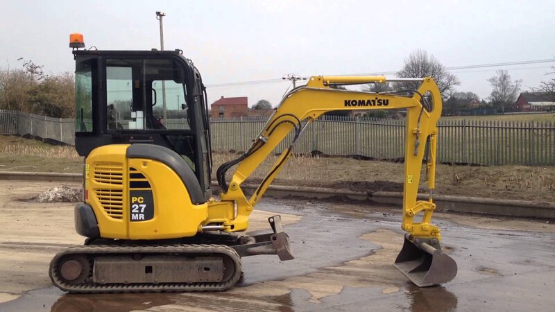 Yellow Excavator on Wet Ground