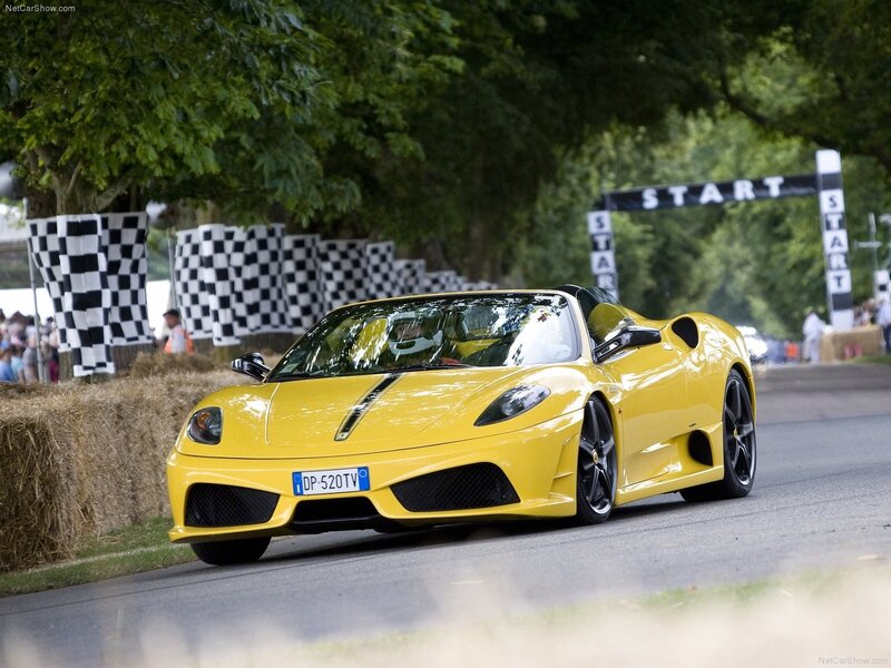 Yellow Ferrari at a race