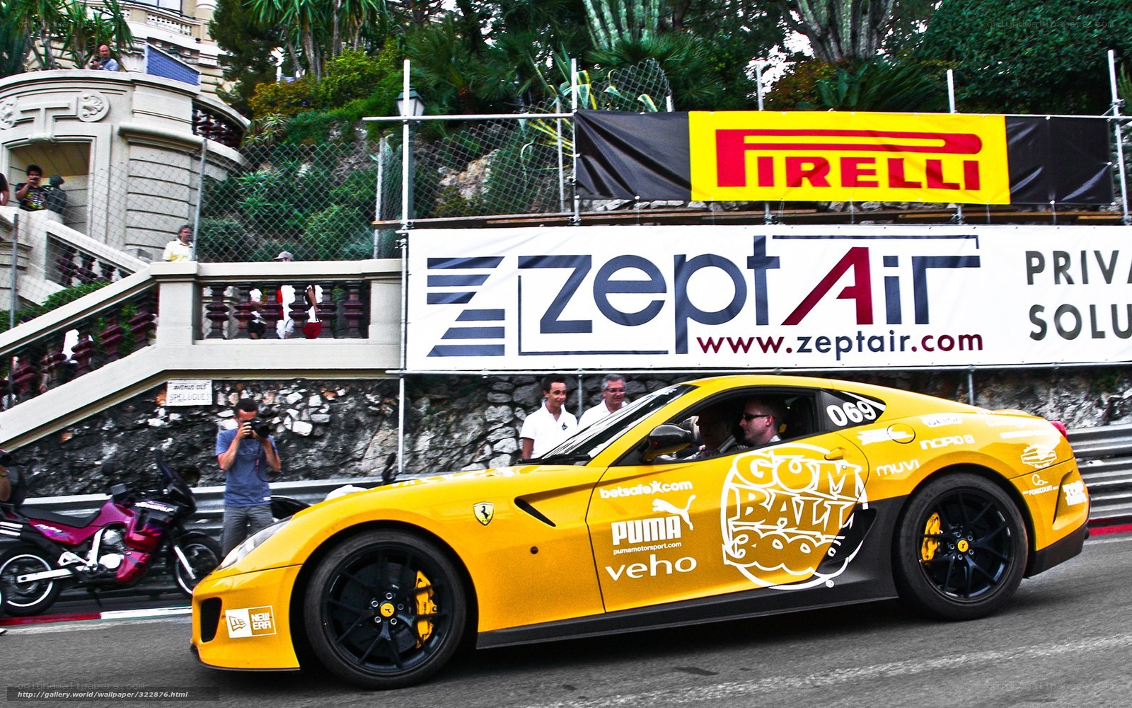 Yellow Ferrari at a race