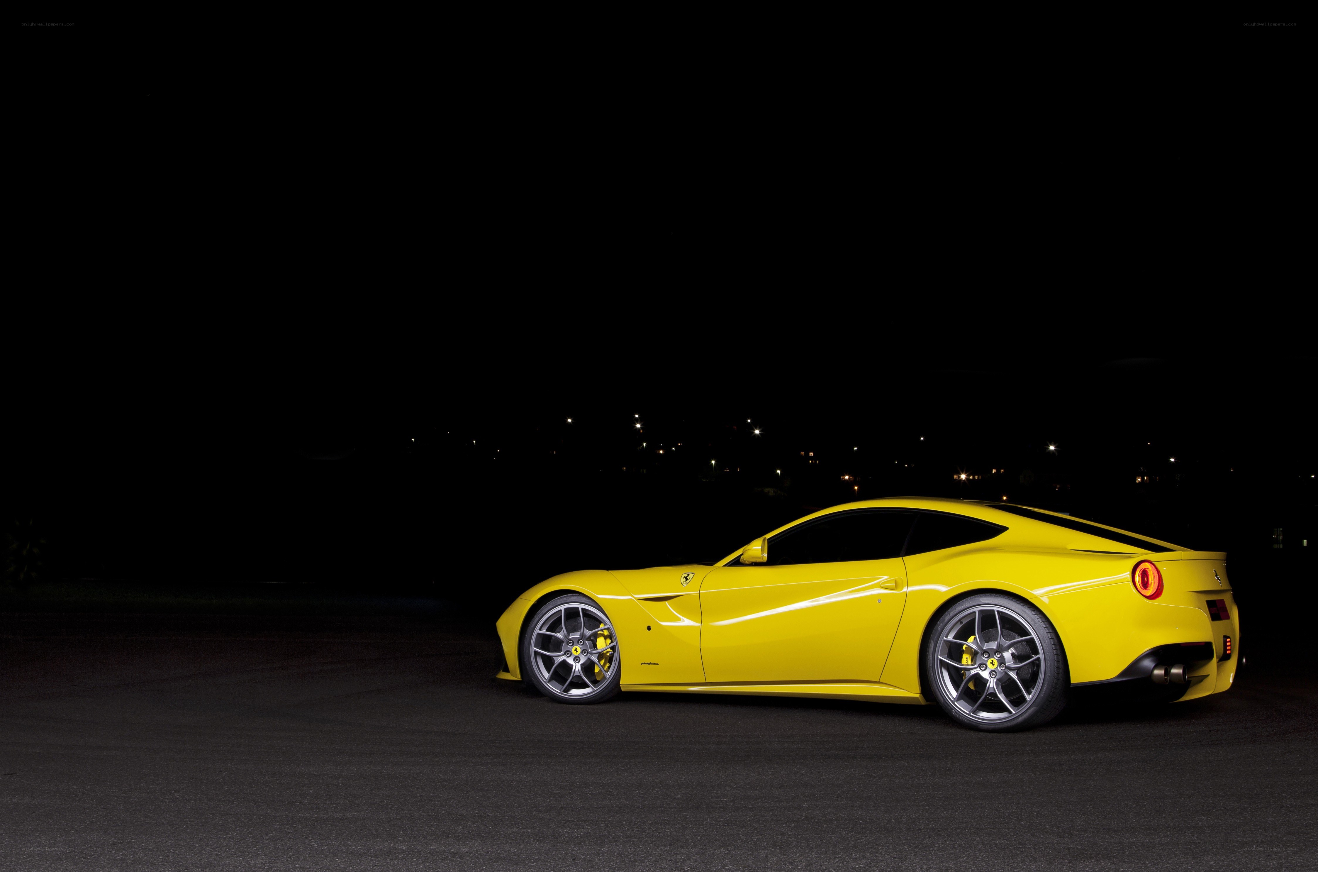 Yellow Ferrari at night