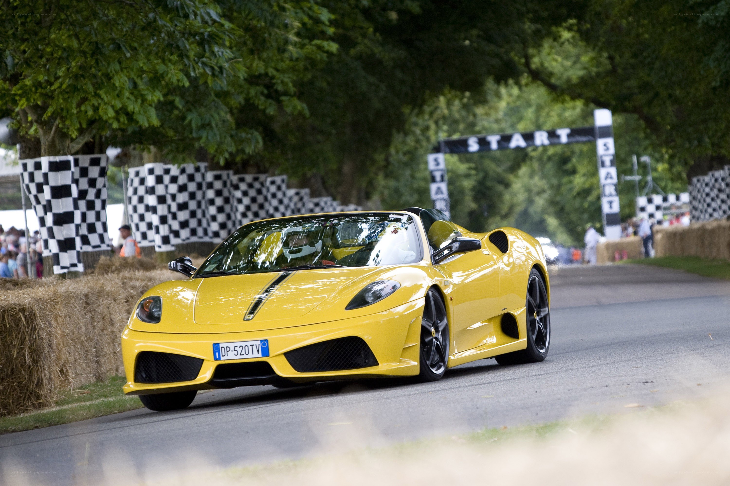 Yellow Ferrari at start line