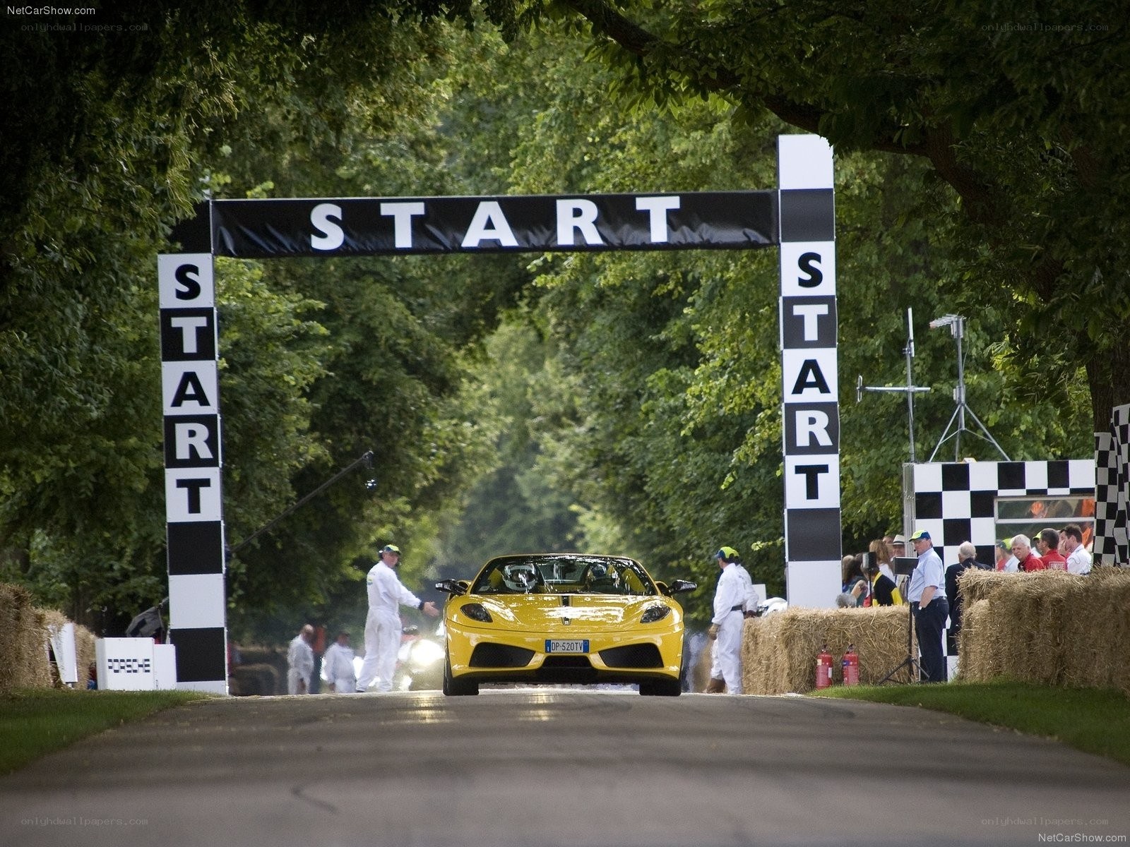 Yellow Ferrari at start line