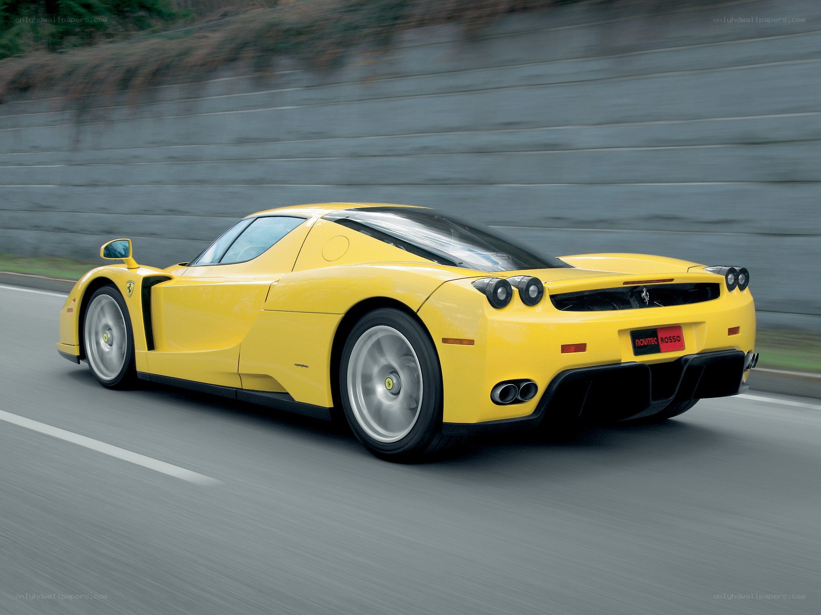 Yellow Ferrari Enzo in motion