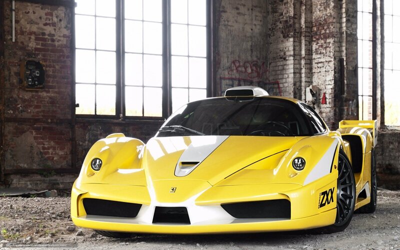 Yellow Ferrari Enzo in warehouse