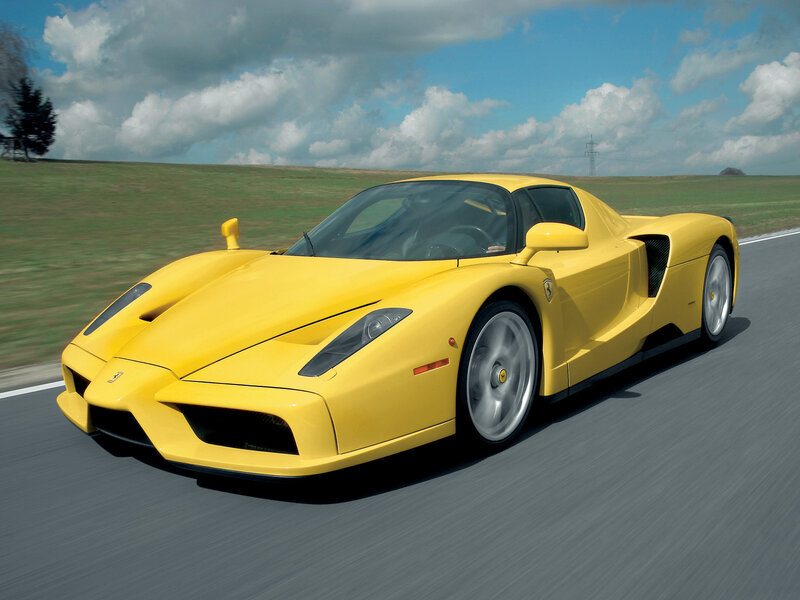 Yellow Ferrari Enzo on a road
