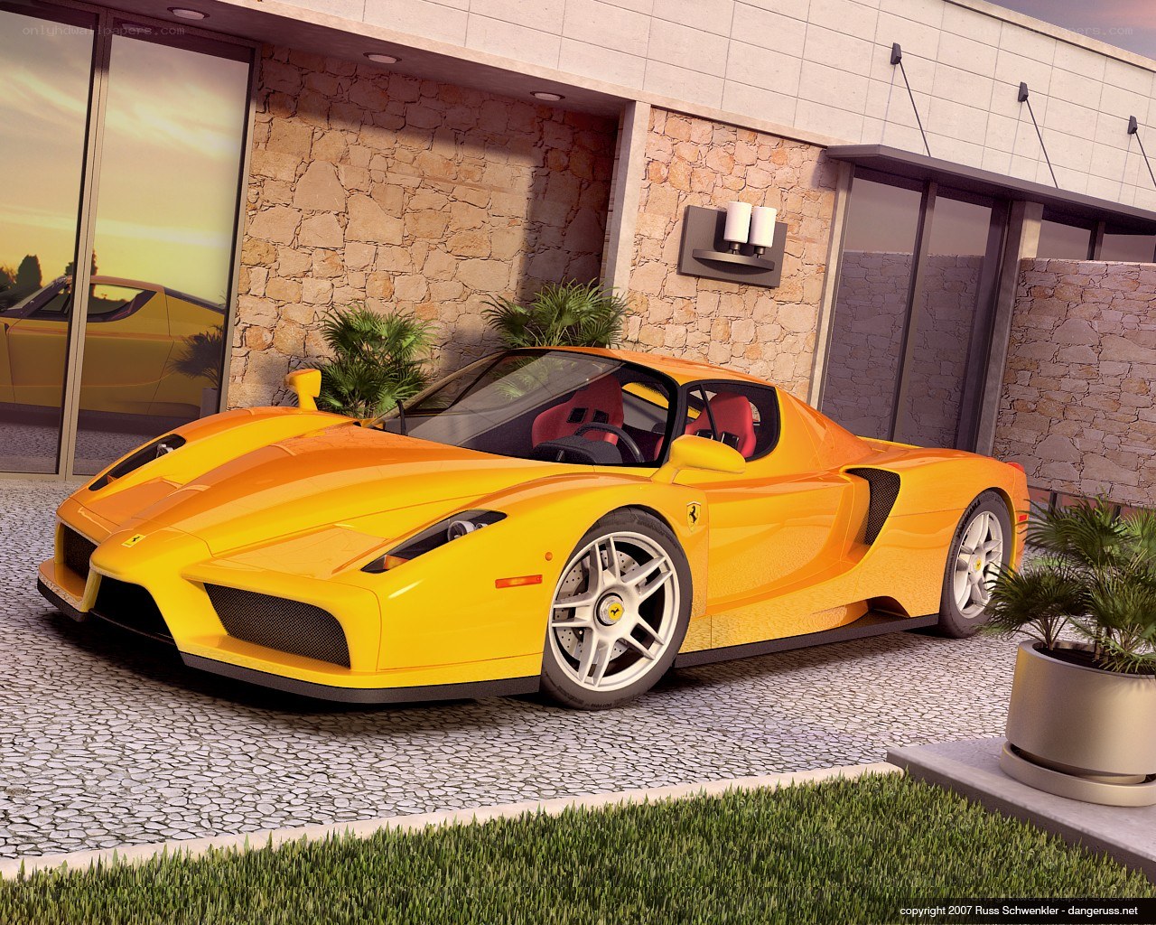 Yellow Ferrari Enzo parked outside