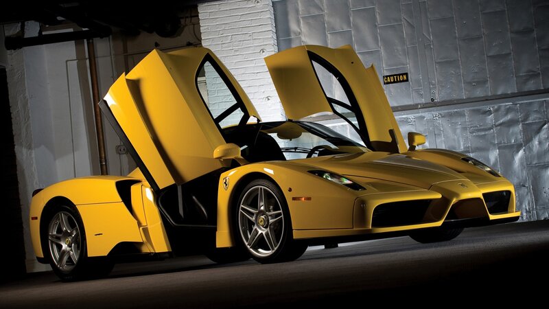 Yellow Ferrari Enzo with doors open