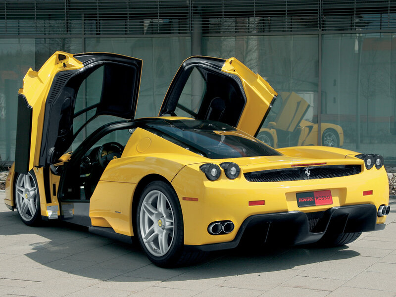 Yellow Ferrari Enzo with doors open