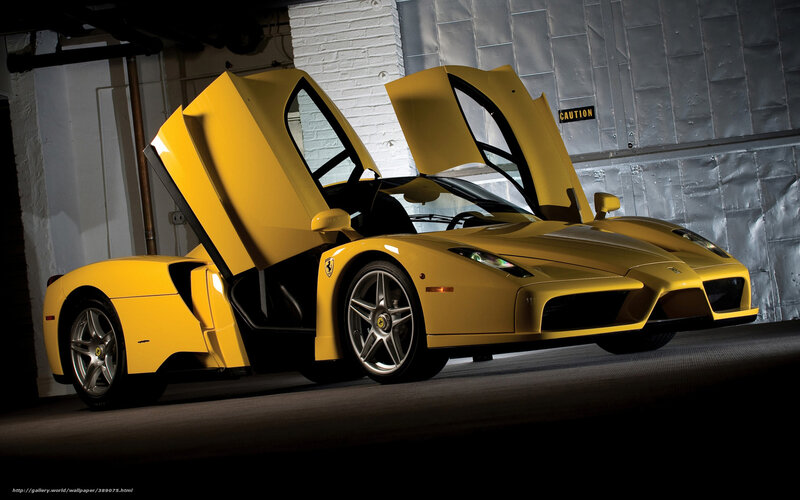 Yellow Ferrari Enzo with doors open