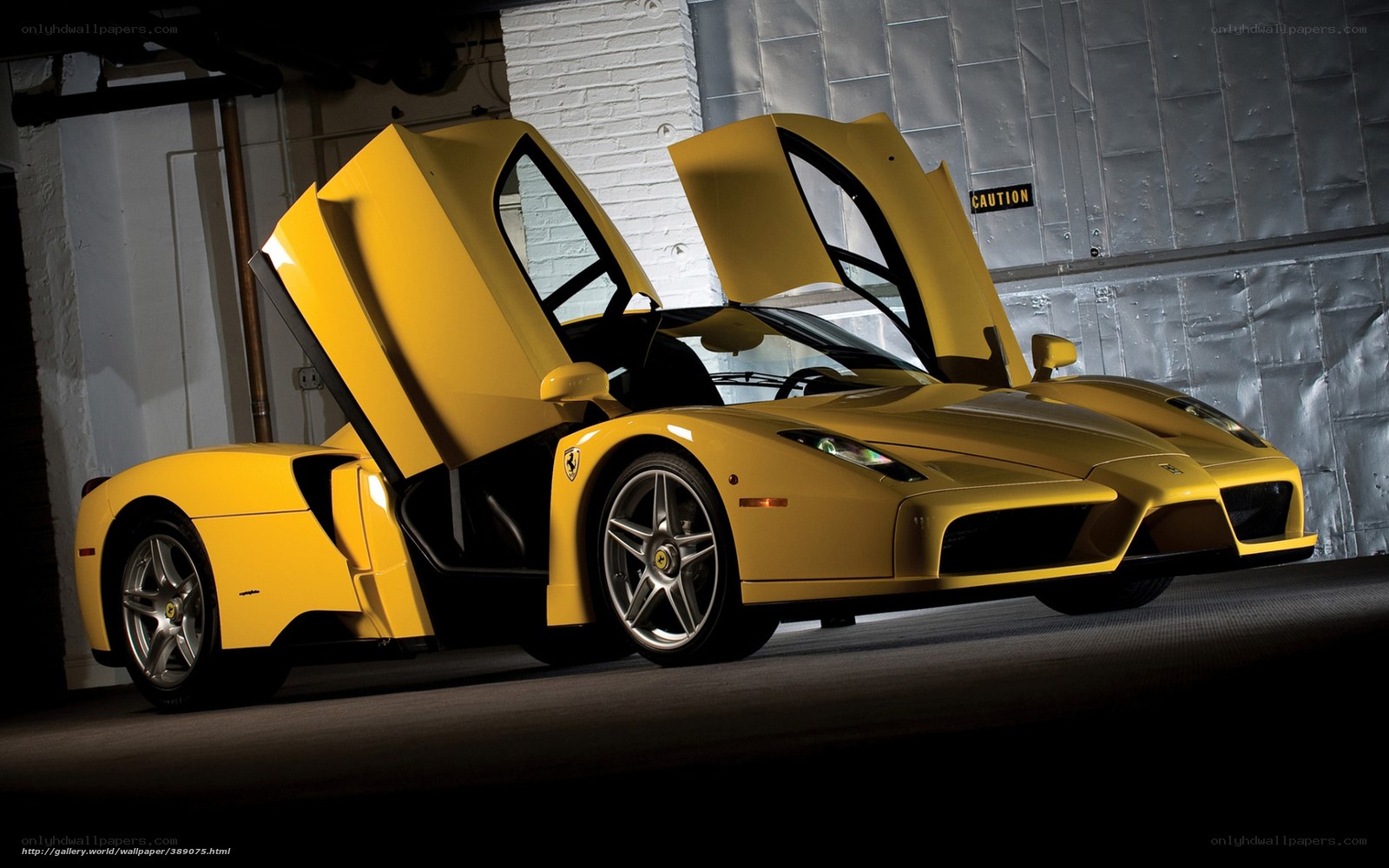 Yellow Ferrari Enzo with doors open