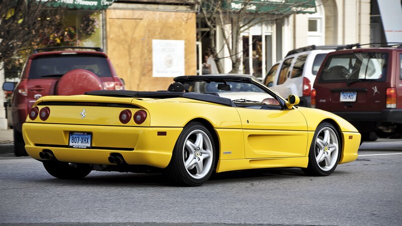 Yellow Ferrari F355 on city street
