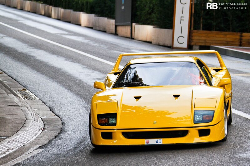 Yellow Ferrari F40 on a wet road
