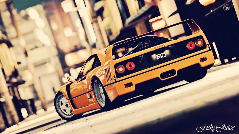 yellow ferrari f40 on city street