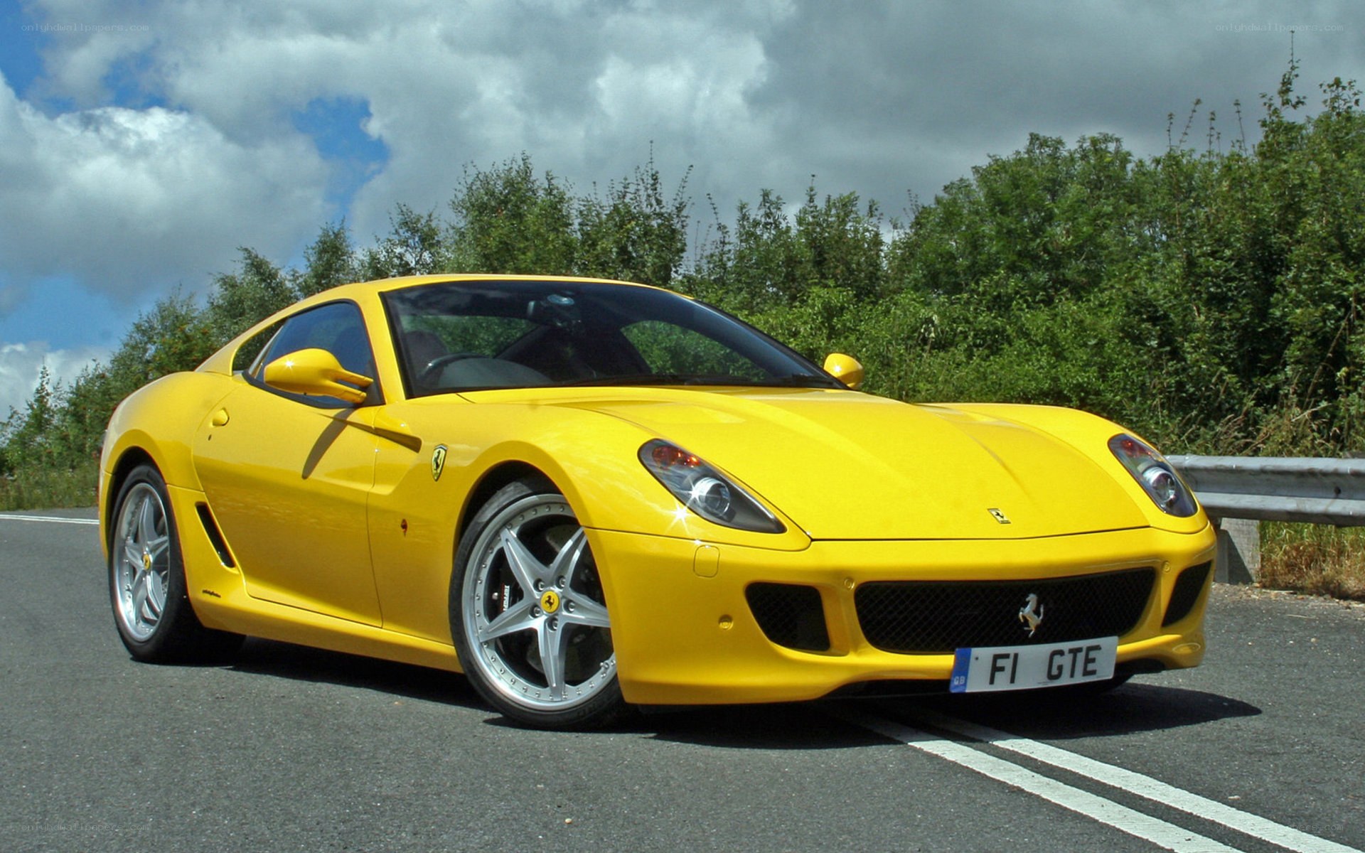 Yellow Ferrari GTE on road