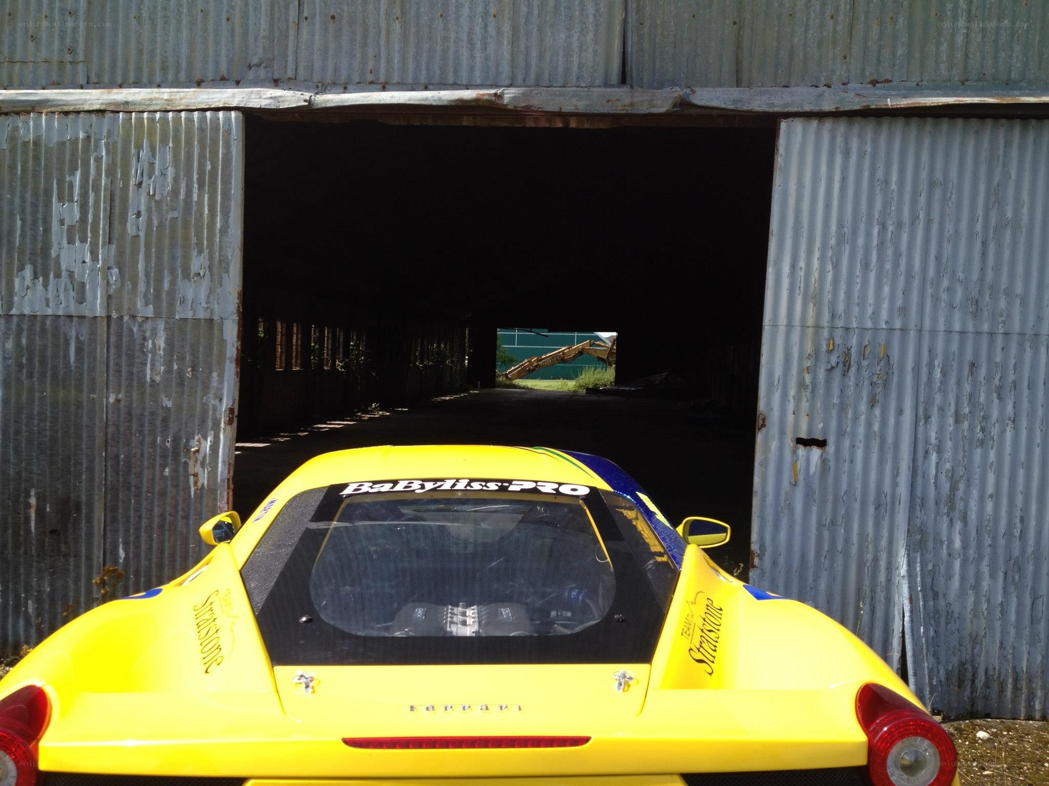 Yellow Ferrari in a garage