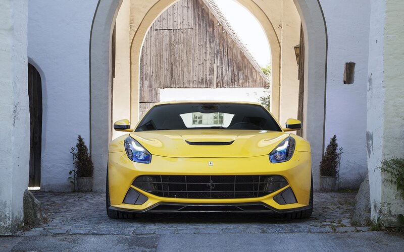 Yellow Ferrari in an archway
