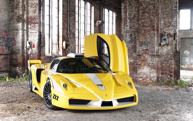 Yellow Ferrari in an old warehouse