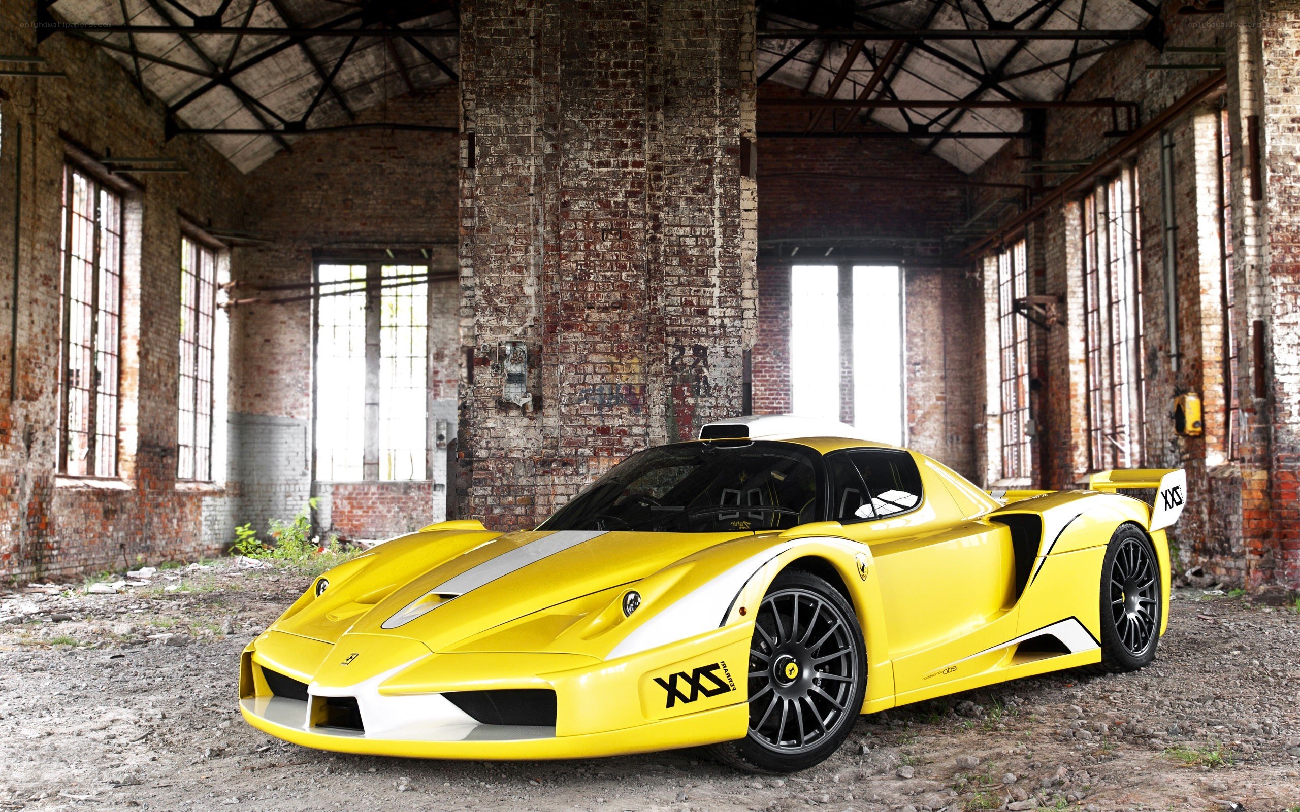 Yellow Ferrari in an old warehouse