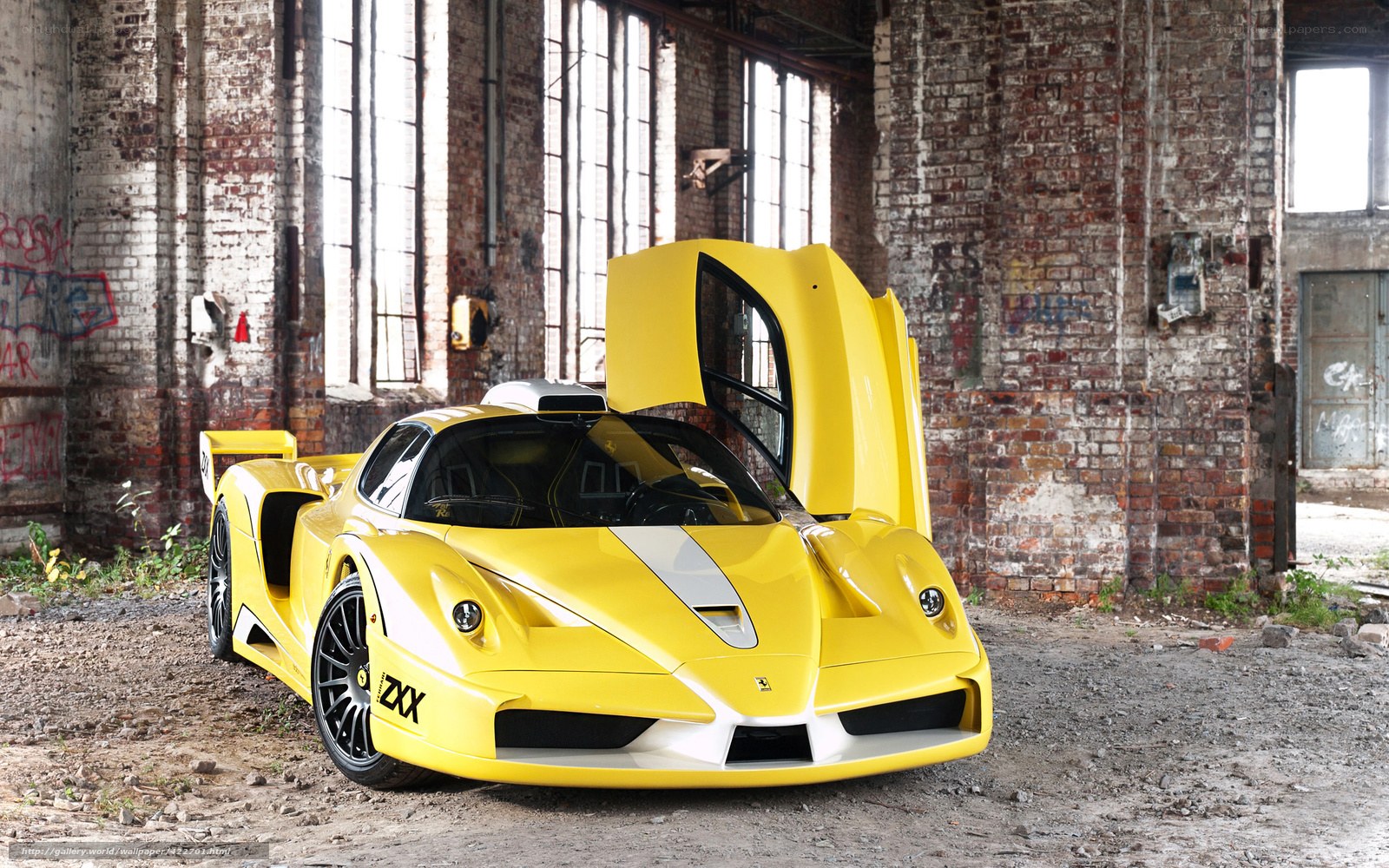 Yellow Ferrari in an old warehouse