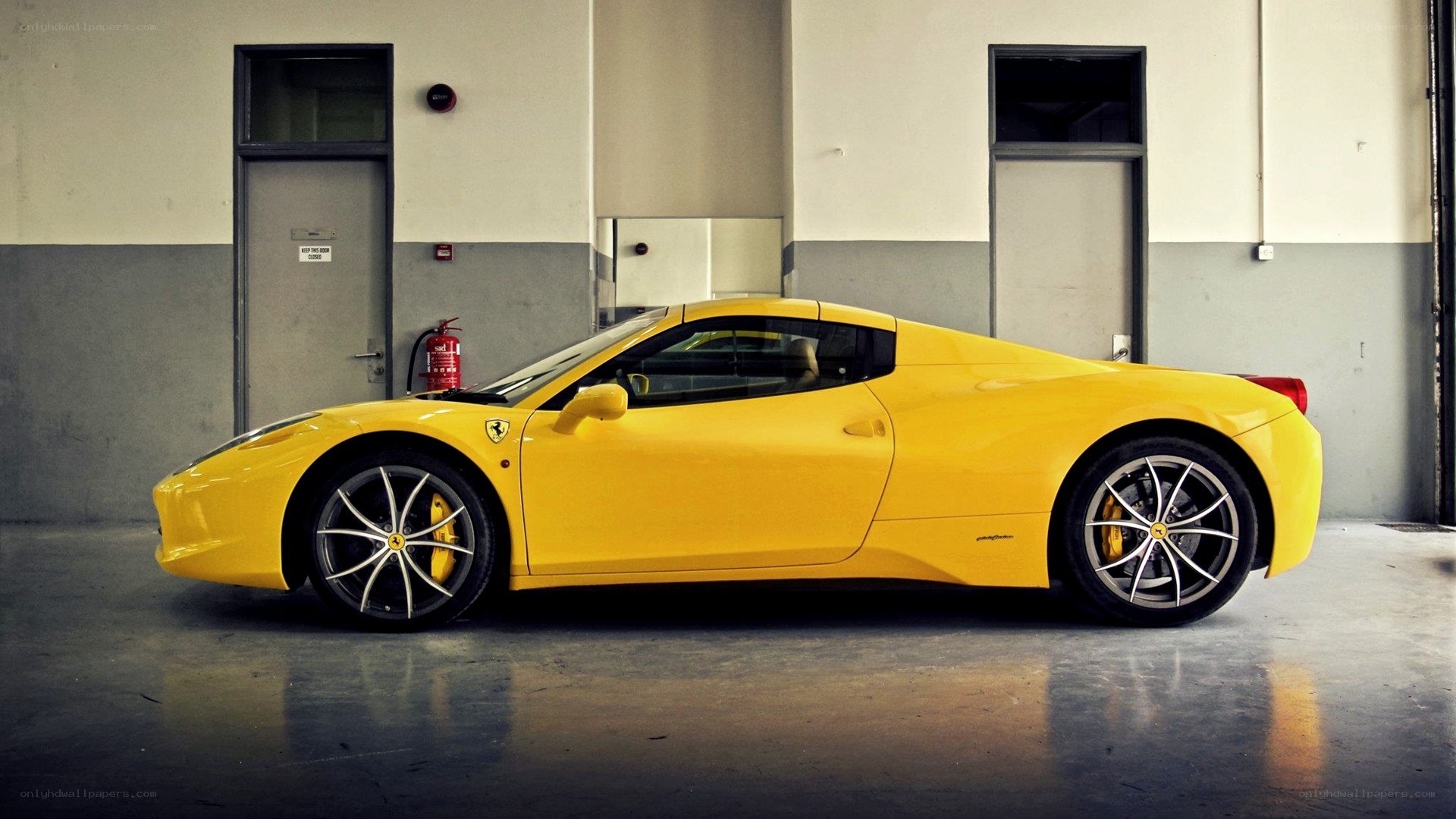 Yellow Ferrari in garage