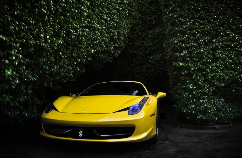 yellow ferrari in green tunnel
