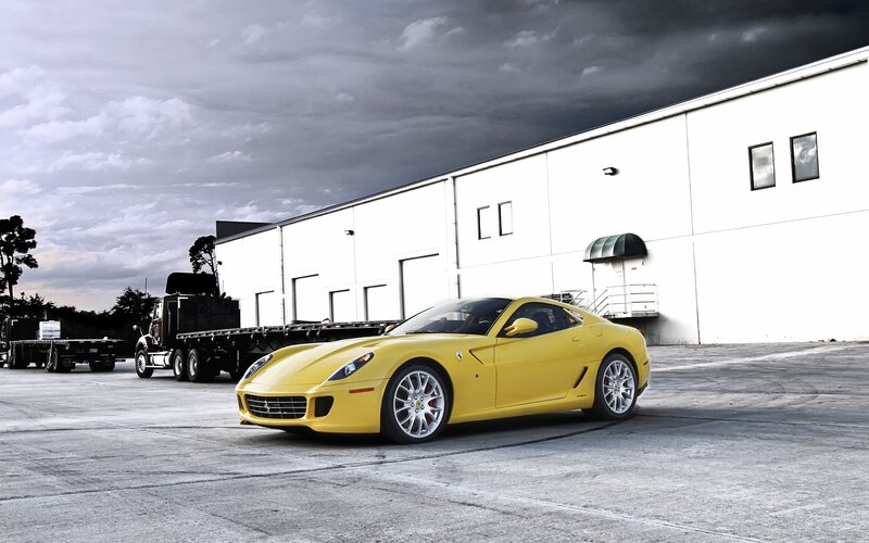 Yellow Ferrari in industrial lot