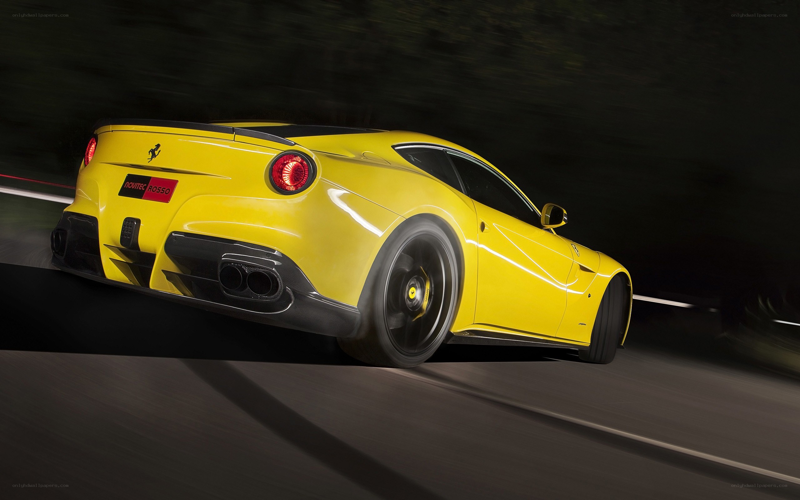 Yellow Ferrari in motion