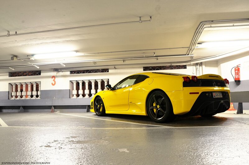 yellow ferrari in parking garage