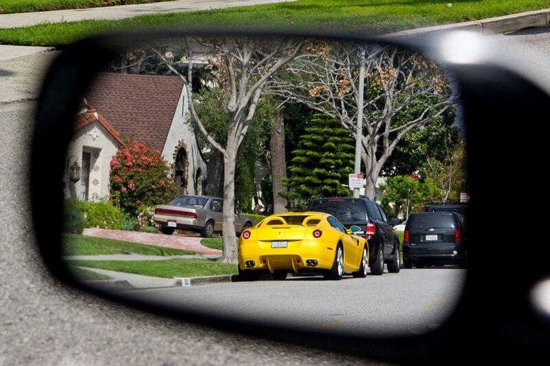Yellow Ferrari in rearview mirror