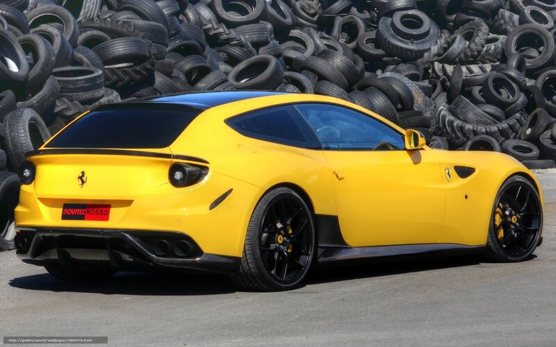Yellow Ferrari in tire yard