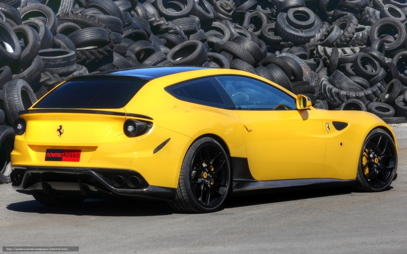 Yellow Ferrari in tire yard