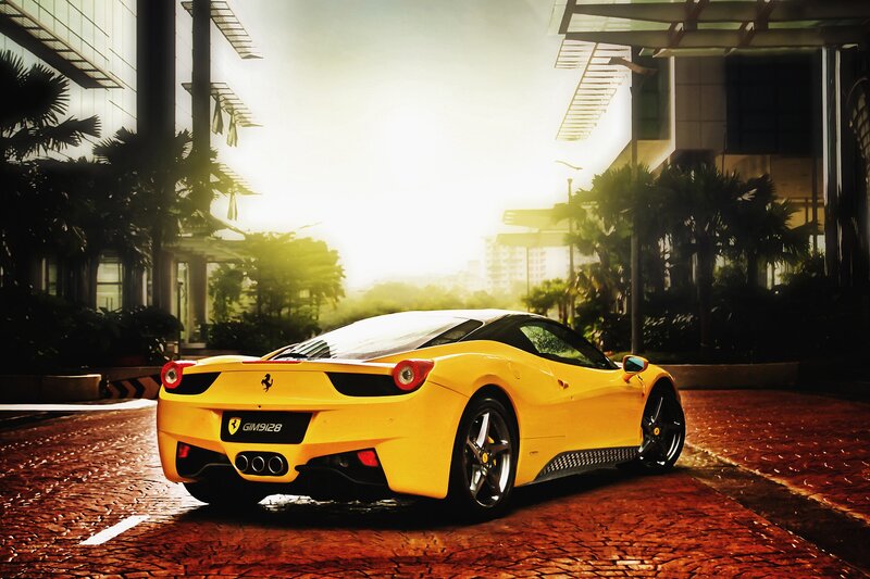 Yellow Ferrari on a city street