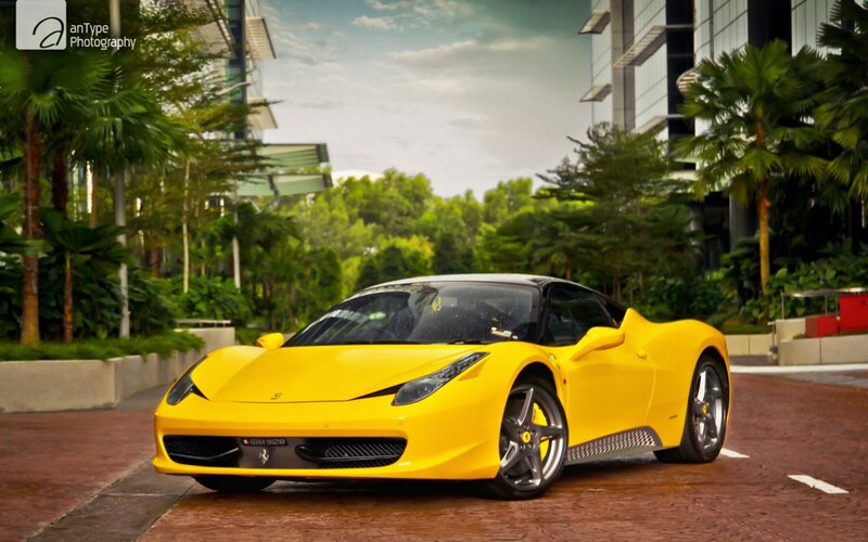 Yellow Ferrari on a city street