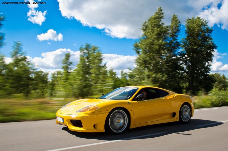 Yellow Ferrari on a country road
