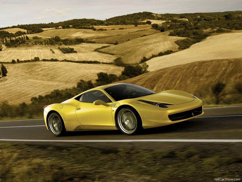 Yellow Ferrari on a country road