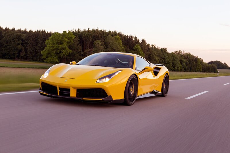 Yellow Ferrari on a country road